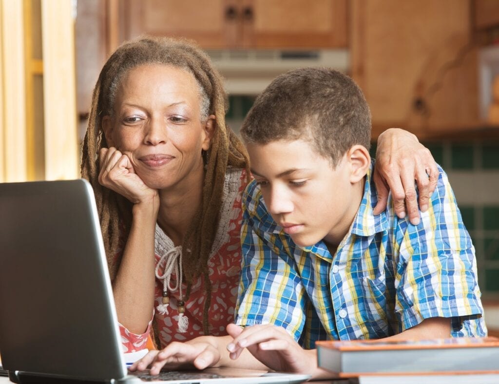 Parent supports a struggling learner at home