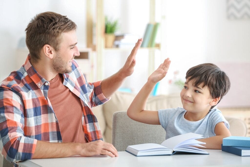 father and son work on reading